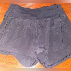 Lululemon running shorts with zipper pocket, built in underwear. Size 0. Black.